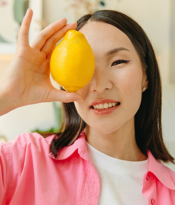 Woman feeling energetic and vibrant in a bright, natural setting.